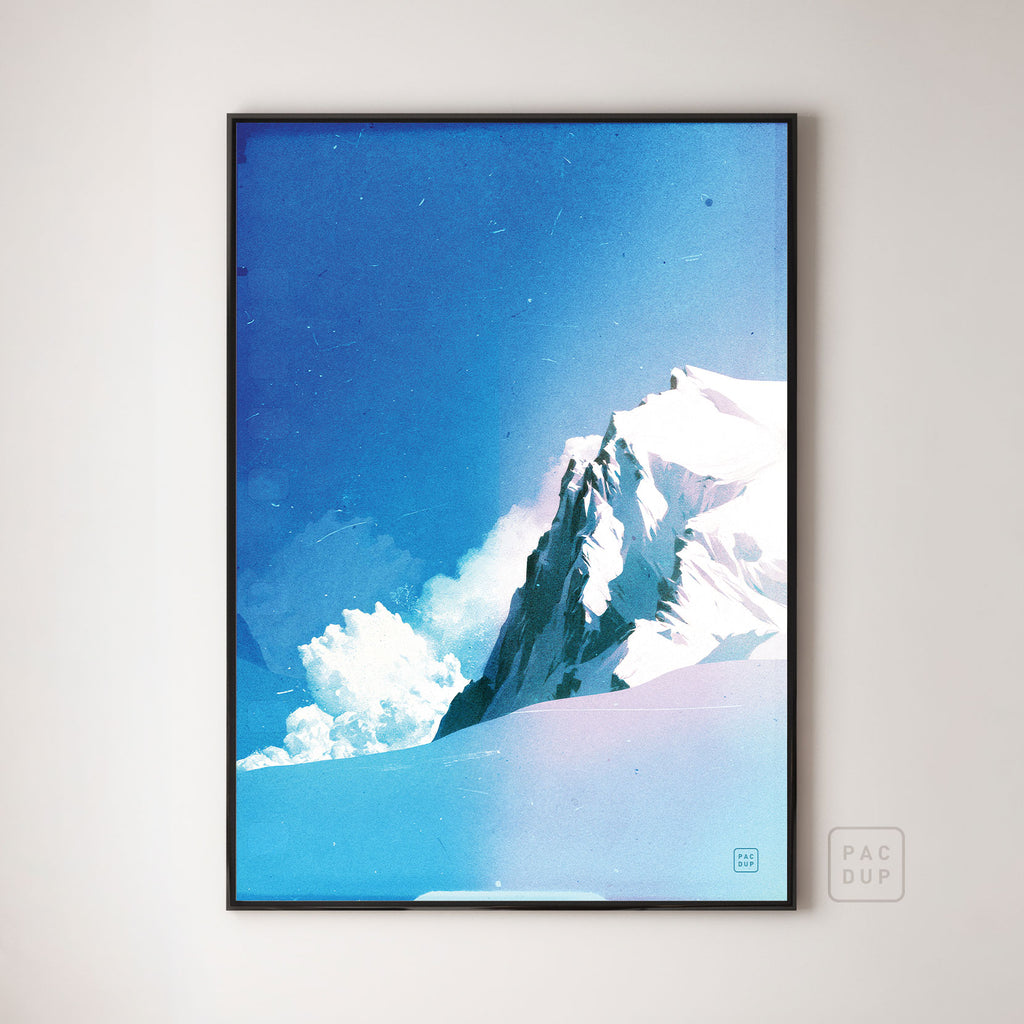Avalanche art print of a snowy mountain peak and billowing snow cloud beneath a blue sky, displayed in a black frame.